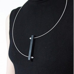 Necklace, bass guitar string and piano fingerboard